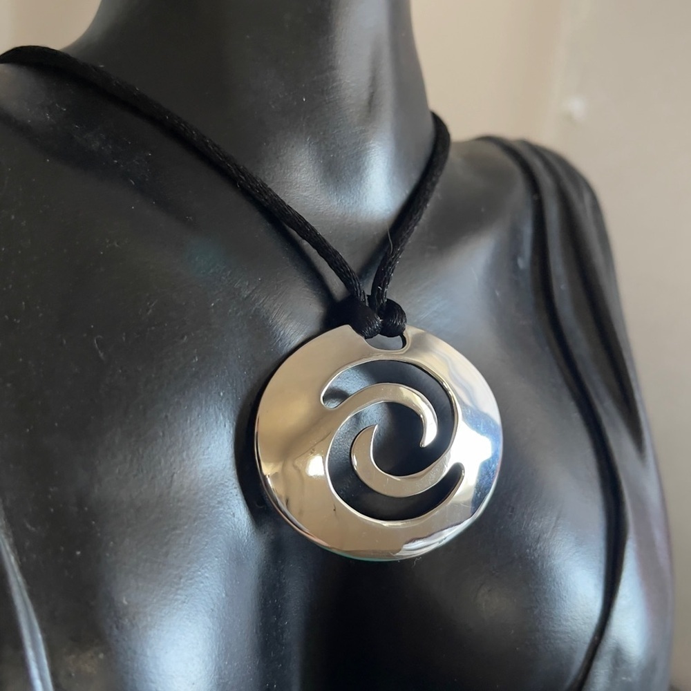 Swirl stainless steel statement necklace with sterling silver clasp